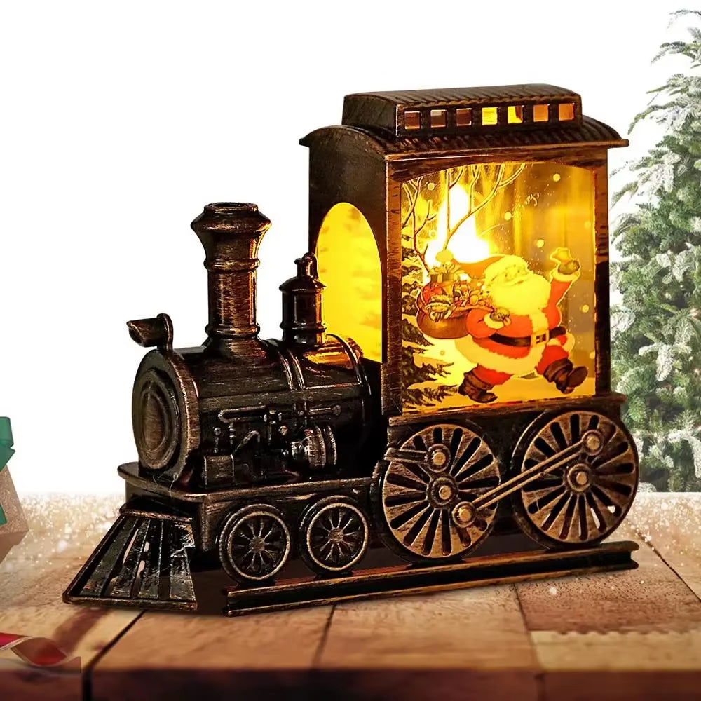 Train Magique Bronze, modèle Père Noël, éclairé par une lumière chaude